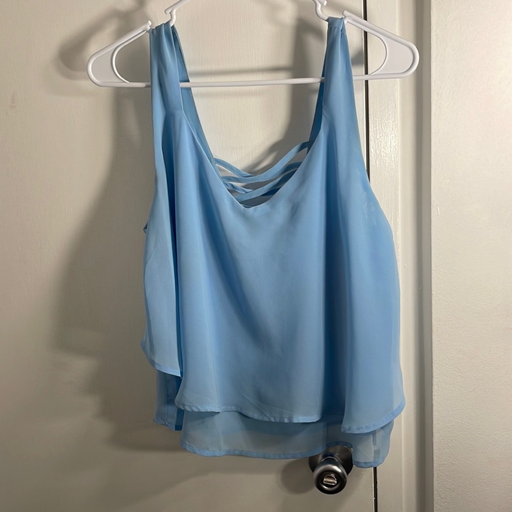 Blue tank top with crisscross detail on the back